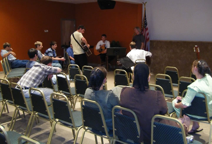 MS - Howie teaching guitar to Mennonite guys